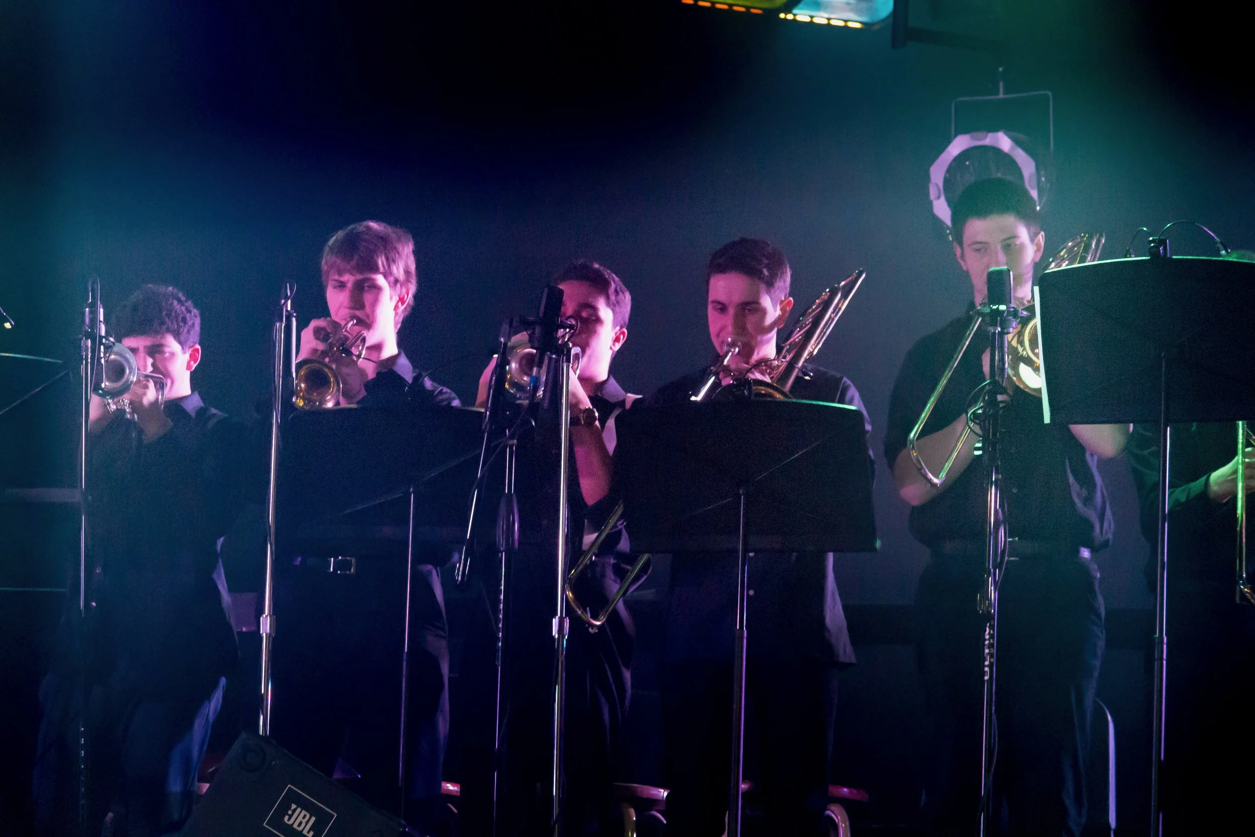 Live concert stage with orchestra and professional lighting